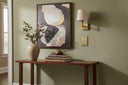 Signature 1G Blank wall plate in Aged Gold on a wall in a styled room