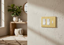 Signature 3G RRT Combo wall plate in Brushed Brass on a wall in a styled room